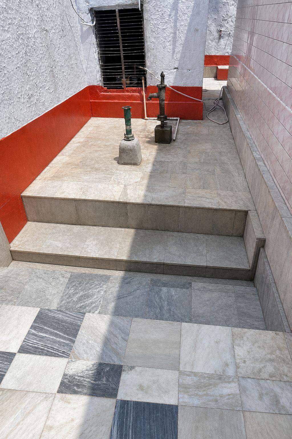 Hand pump in the temple courtyard for jal